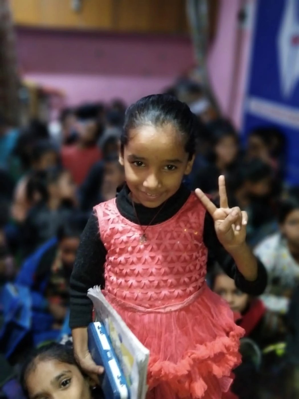 A smiling child at Aadi Foundation